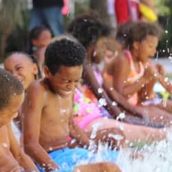 Children splashing water in pool